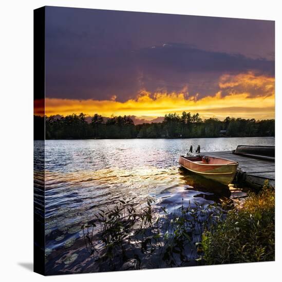 Rowboat Tied to Dock on Beautiful Lake with Dramatic Sunset-elenathewise-Stretched Canvas