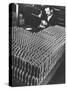 Rows of 15 cm Shells on Table Where Worker Uses Hammer and Stamping Tool at Skoda Munitions Factory-Margaret Bourke-White-Stretched Canvas