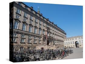 Rows of bicycles outside the Christiansborgs Palace, home of the Danish Parliament, Copenhagen-Jean Brooks-Stretched Canvas