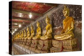 Rows of Gold Buddha Statues, Wat Suthat Temple, Bangkok, Thailand, Southeast Asia, Asia-Stephen Studd-Stretched Canvas