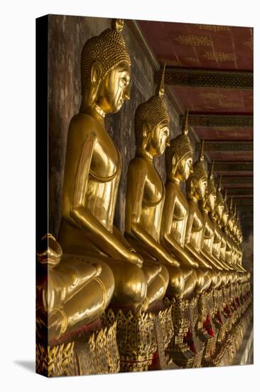 Rows of Gold Buddha Statues, Wat Suthat Temple, Bangkok, Thailand, Southeast Asia, Asia-Stephen Studd-Stretched Canvas