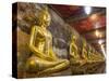 Rows of Gold Buddha Statues, Wat Suthat Temple, Bangkok, Thailand, Southeast Asia, Asia-Stephen Studd-Stretched Canvas