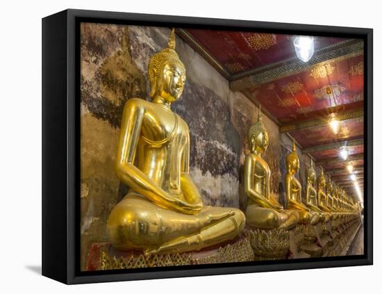 Rows of Gold Buddha Statues, Wat Suthat Temple, Bangkok, Thailand, Southeast Asia, Asia-Stephen Studd-Framed Stretched Canvas