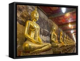 Rows of Gold Buddha Statues, Wat Suthat Temple, Bangkok, Thailand, Southeast Asia, Asia-Stephen Studd-Framed Stretched Canvas