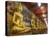 Rows of Gold Buddha Statues, Wat Suthat Temple, Bangkok, Thailand, Southeast Asia, Asia-Stephen Studd-Stretched Canvas