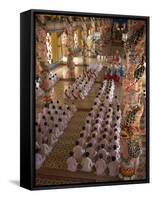 Rows of Monks at Prayer Inside a Temple of the Caodai Religious Sect, at Tay Ninh, Vietnam-Waltham Tony-Framed Stretched Canvas