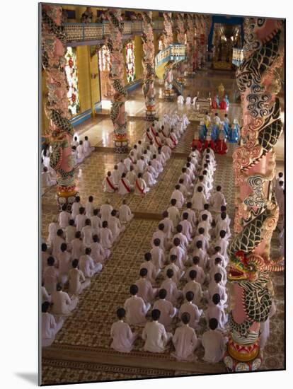 Rows of Monks at Prayer Inside a Temple of the Caodai Religious Sect, at Tay Ninh, Vietnam-Waltham Tony-Mounted Photographic Print