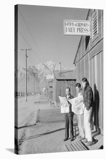 Roy Takeno (Editor) and Group Reading Manzanar Paper [I.E. Los Angeles Times] in Front of Office-Ansel Adams-Stretched Canvas