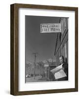 Roy Takeno, editor of Manzanar Free Press, reading the paper at the Manzanar War Relocation Center-Ansel Adams-Framed Photographic Print