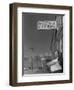 Roy Takeno, editor of Manzanar Free Press, reading the paper at the Manzanar War Relocation Center-Ansel Adams-Framed Photographic Print