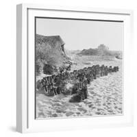 Rubber Soled Shoes in Rows on Beach-null-Framed Photographic Print