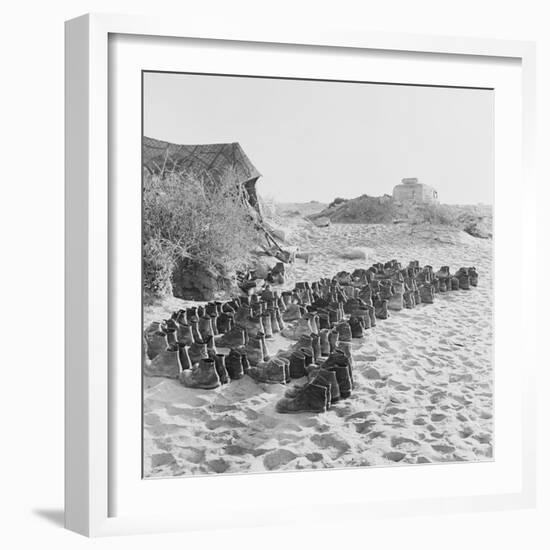 Rubber Soled Shoes in Rows on Beach-null-Framed Photographic Print