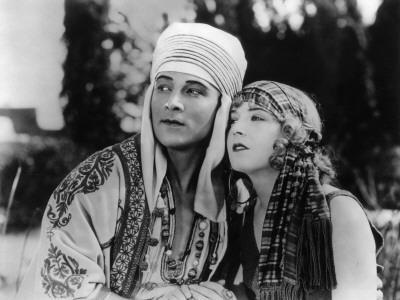 https://imgc.allpostersimages.com/img/posters/rudolph-valentino-and-vilma-banky-the-son-of-the-sheik-1926_u-L-Q10V98L0.jpg?artPerspective=n