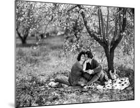 Rudolph Valentino with Alla Nazimova Under Blossom Tree, 1921-null-Mounted Art Print