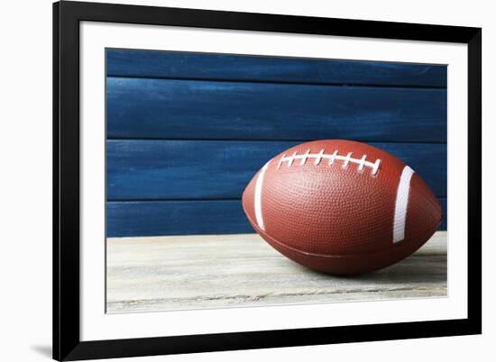 Rugby Ball on Wooden Background-Yastremska-Framed Photographic Print