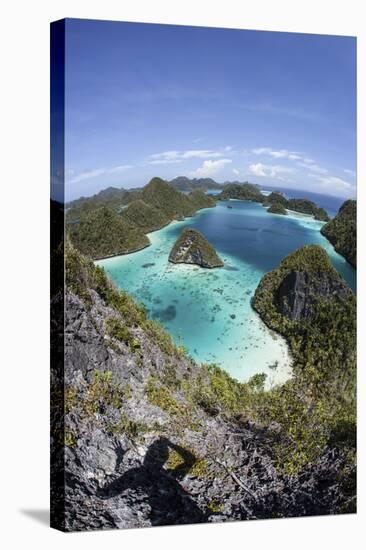 Rugged Limestone Islands Surround a Gorgeous Lagoon in Raja Ampat-Stocktrek Images-Stretched Canvas