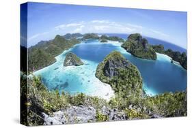 Rugged Limestone Islands Surround a Gorgeous Lagoon in Raja Ampat-Stocktrek Images-Stretched Canvas