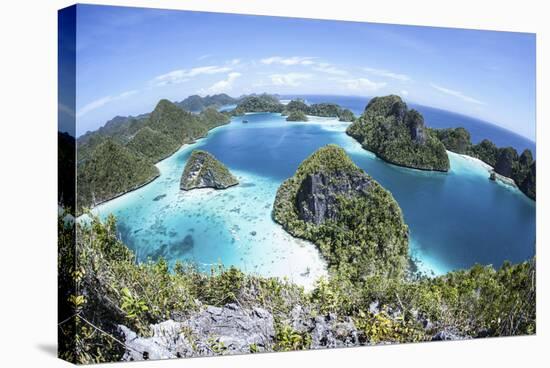 Rugged Limestone Islands Surround a Gorgeous Lagoon in Raja Ampat-Stocktrek Images-Stretched Canvas