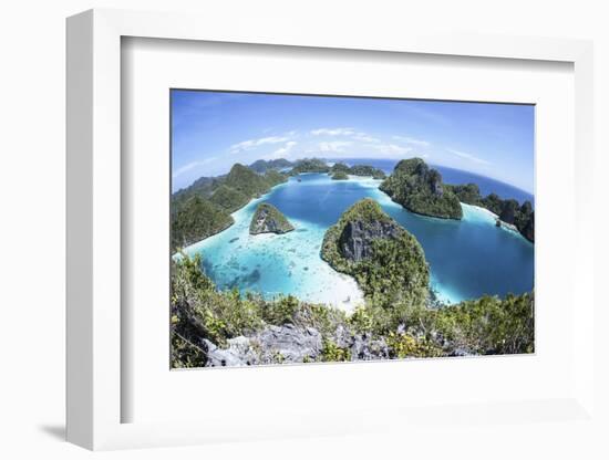 Rugged Limestone Islands Surround a Gorgeous Lagoon in Raja Ampat-Stocktrek Images-Framed Photographic Print