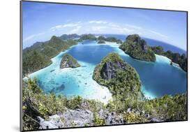 Rugged Limestone Islands Surround a Gorgeous Lagoon in Raja Ampat-Stocktrek Images-Mounted Photographic Print