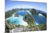 Rugged Limestone Islands Surround a Gorgeous Lagoon in Raja Ampat-Stocktrek Images-Mounted Photographic Print