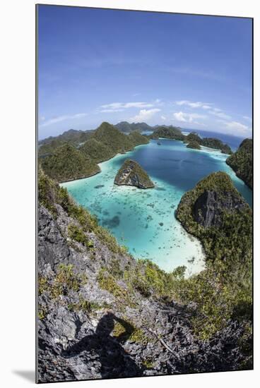 Rugged Limestone Islands Surround a Gorgeous Lagoon in Raja Ampat-Stocktrek Images-Mounted Photographic Print