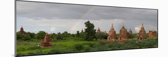 Ruined stupas with rainbow near village of Min Nan Thu, Bagan, Mandalay Region, Myanmar-null-Mounted Photographic Print