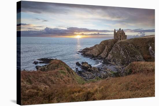 Ruins of Dunskey Castle on rugged coastline at sunset-Stuart Black-Stretched Canvas