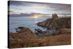 Ruins of Dunskey Castle on rugged coastline at sunset-Stuart Black-Stretched Canvas