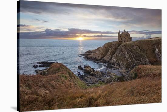 Ruins of Dunskey Castle on rugged coastline at sunset-Stuart Black-Stretched Canvas