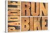 Run, Bike,  Paddle - Triathlon or Recreation Concept - Isolated Word Abstract in Vintage Letterpres-PixelsAway-Stretched Canvas