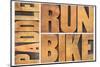 Run, Bike,  Paddle - Triathlon or Recreation Concept - Isolated Word Abstract in Vintage Letterpres-PixelsAway-Mounted Photographic Print