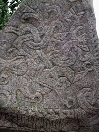 https://imgc.allpostersimages.com/img/posters/rune-stone-relief-depicting-dragon-983-jelling_u-L-PPK7040.jpg?artPerspective=n