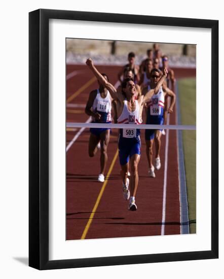 Runner Celebrates at the Finish Line-null-Framed Photographic Print