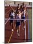 Runner Celebrates at the Finish Line-null-Mounted Photographic Print