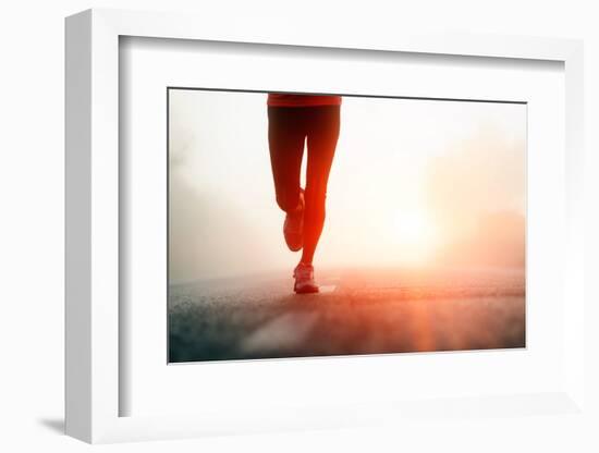 Runner Feet Running on Road Closeup on Shoe. Woman Fitness Sunrise Jog Workout Welness Concept.-warrengoldswain-Framed Photographic Print