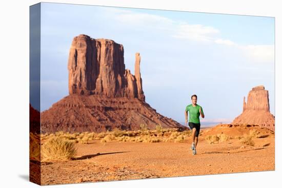 Runner. Running Man Sprinting in Monument Valley. Athlete Runner Cross Country Trail Running Outdoo-Maridav-Stretched Canvas