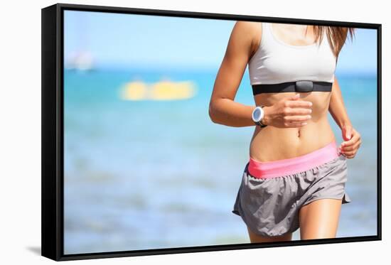 Runner Woman with Heart Rate Monitor Running on Beach with Watch and Sports Bra Top. Beautiful Fit-Maridav-Framed Stretched Canvas