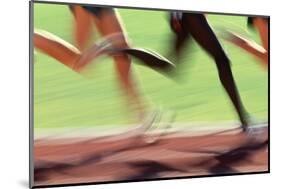 Runners Legs in Motion (Blurred Motion)-Peter Skinner-Mounted Photographic Print