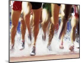 Runners Legs Splashing Through Water Jump of Track and Field Steeplechase Race, Sydney, Australia-Paul Sutton-Mounted Photographic Print