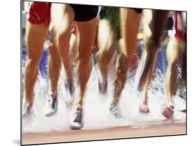 Runners Legs Splashing Through Water Jump of Track and Field Steeplechase Race, Sydney, Australia-Paul Sutton-Mounted Photographic Print