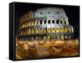 Runners Make Their Way Past the Colosseum in Rome-null-Framed Stretched Canvas