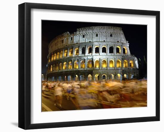 Runners Make Their Way Past the Colosseum in Rome-null-Framed Premium Photographic Print
