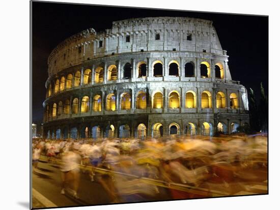 Runners Make Their Way Past the Colosseum in Rome-null-Mounted Photographic Print