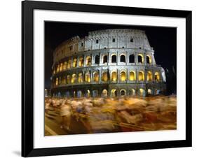 Runners Make Their Way Past the Colosseum in Rome-null-Framed Photographic Print