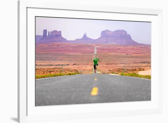 Running Man - Runner Sprinting on Road by Monument Valley. Concept with Sprinting Fast Training For-Maridav-Framed Photographic Print