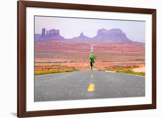 Running Man - Runner Sprinting on Road by Monument Valley. Concept with Sprinting Fast Training For-Maridav-Framed Photographic Print