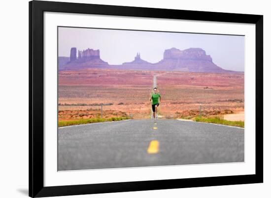 Running Man - Runner Sprinting on Road by Monument Valley. Concept with Sprinting Fast Training For-Maridav-Framed Photographic Print