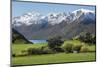 Rural scene of Lake Wanaka backed by snow capped mountains, New Zealand-Ed Rhodes-Mounted Photographic Print