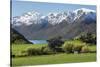 Rural scene of Lake Wanaka backed by snow capped mountains, New Zealand-Ed Rhodes-Stretched Canvas